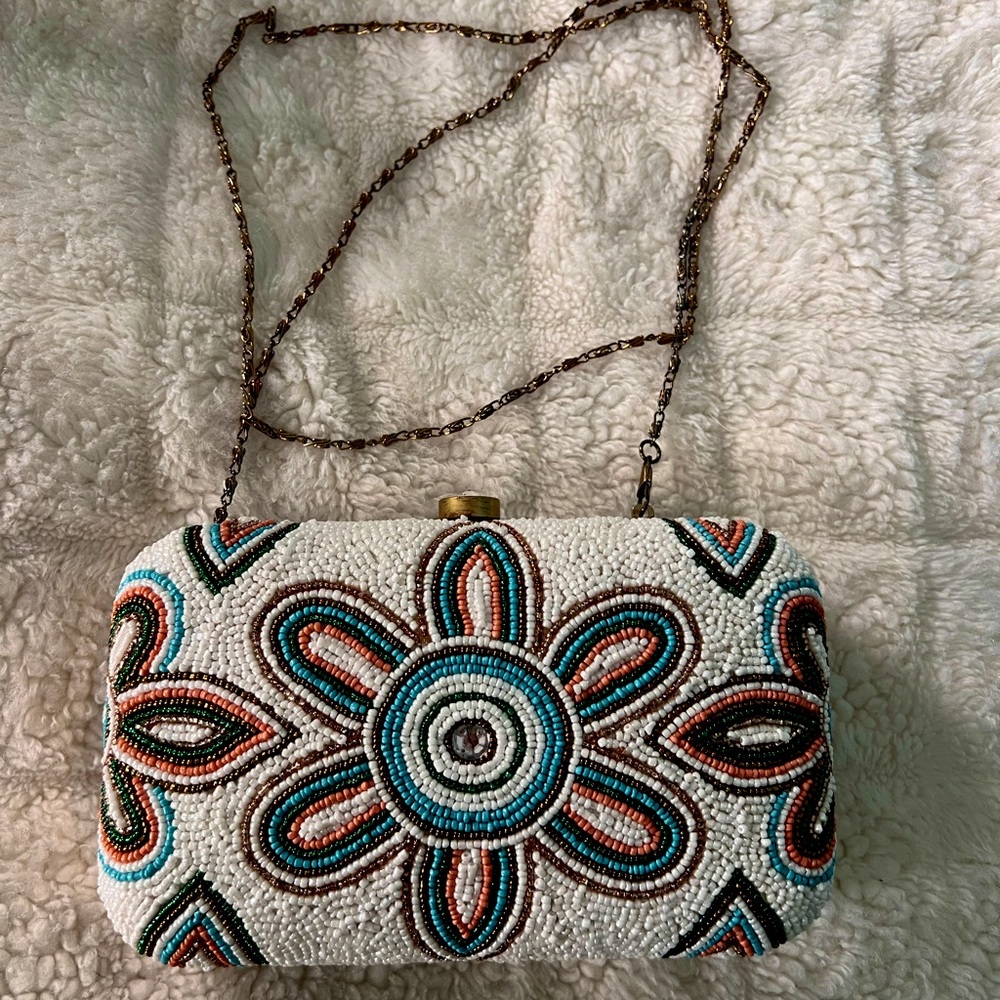 Cato’s floral beaded clutch with gold chain
